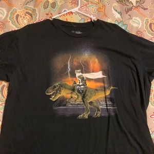 cat riding a dinosaur shirt?